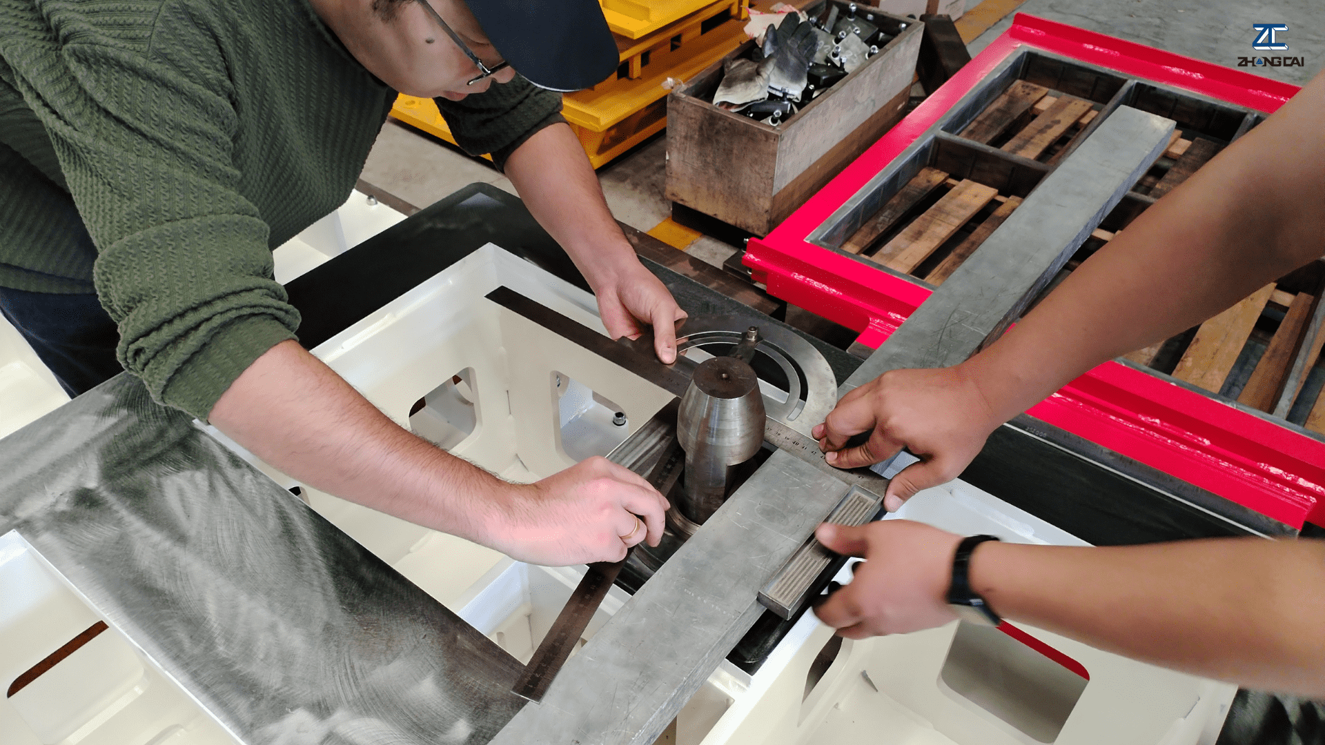 02 ZCJK engineers inspecting custom CNC-machined concrete block molds in the factory..png