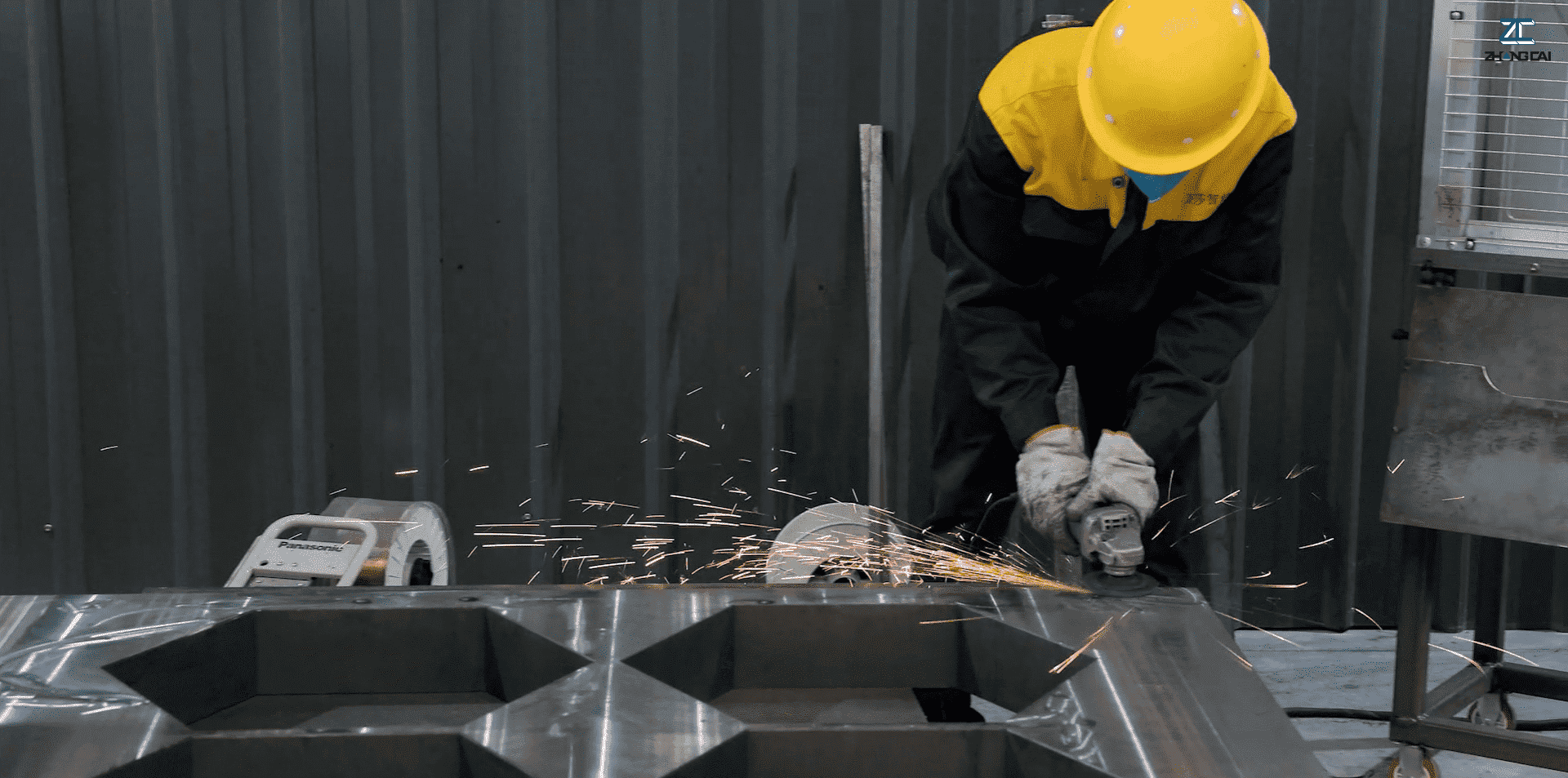 02 ZCJK factory workers performing precision grinding and finishing on steel